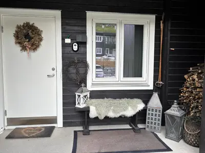 a front door of a house with a window at Apartment in Myrkdalen Voss in Vossevangen