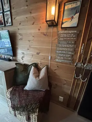 a room with a bench with pillows on a wall at Apartment in Myrkdalen Voss in Vossevangen