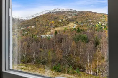 a view of a mountain from a window at Idyllic Apartment at Strandafjellet in Stranda