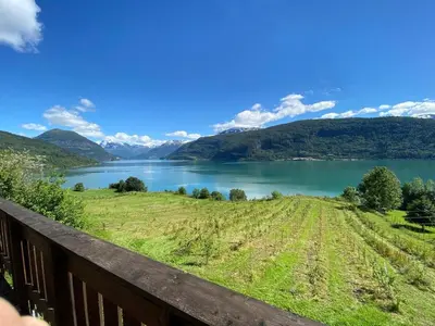 a view of a lake from a balcony at Stryn - Faleide - Cabin Fjord view in Stryn