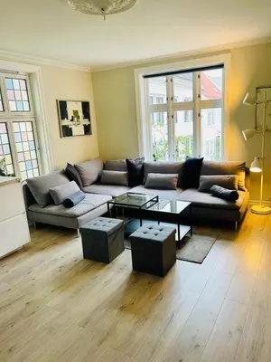 a living room with a couch and a coffee table at Skuteviken House in Bergen