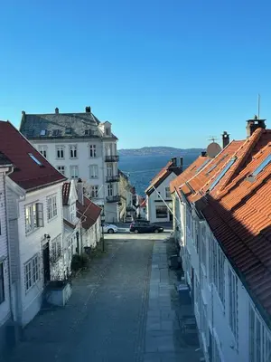 an empty street in a town with buildings at Skuteviken House in Bergen