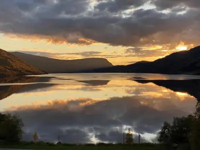 a large body of water with a cloudy sky at Perla i Nordfjord in Emhjella