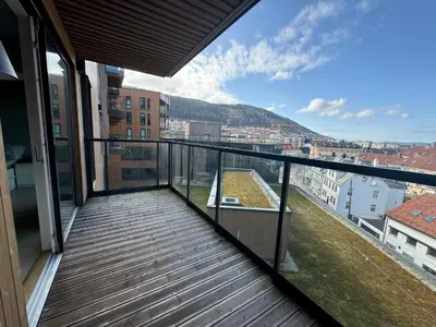 a balcony with a view of a city at Modern, brand-new apartment in the heart of Bergen in Bergen