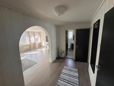 an empty hallway with an archway in a house at Trolltunga Apt for up to 5 people with balcony in Tysso