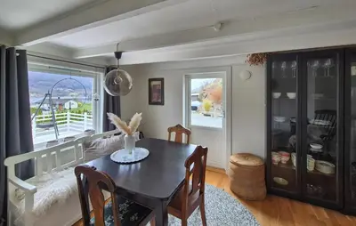 a dining room with a table and a window at Pet Friendly Home In Nedre Vats in Åmsosen