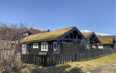 an old log cabin with a grass roof at Lovely Home In Straumgjerde in Brunstad