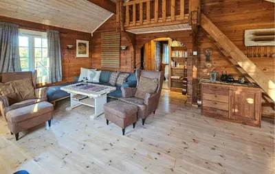 a living room with a couch and a table at Stunning Home In Flesberg With Sauna in Flesberg