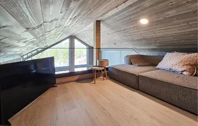 a room with a couch and a table and a window at Beautiful Home In Tuddal With Wifi in Tuddal