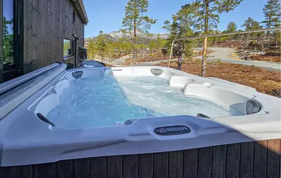 a jacuzzi tub on the side of a house at Beautiful Home In Tuddal With Wifi in Tuddal