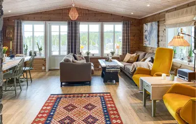 a living room with a couch and a table at Gorgeous Home In Oppdal With Wifi in Oppdal