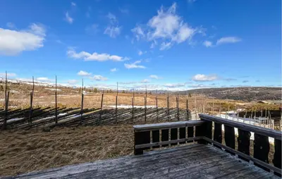 a bench sitting on top of a wooden deck at Stunning Apartment In Røn With Sauna in Ron