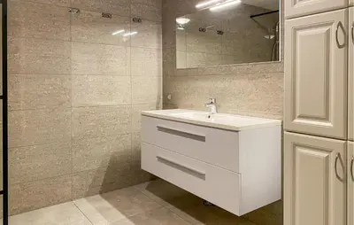 a bathroom with a white sink and a mirror at Nice Home In Kverva With Wifi in Kverva