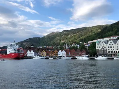 a town with a harbor with boats in the water at Stay where the mountains begin in Bømlo