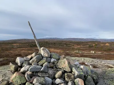 a pile of rocks on top of a field at Gvelvåsen Panorama, Blefjell, family cabin with view and nature in Flesberg