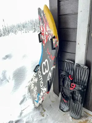 a snowboard is hanging on a wall next to a window at 3 Bedroom Apartment with nice view by Gaustatoppen in Gaustablikk
