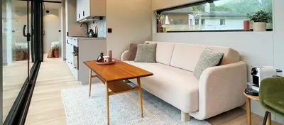 a living room with a couch and a table at Flåm Retreat in Aurland
