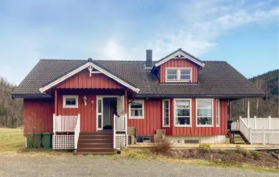 a red house with a black roof at 4 Bedroom Nice Home In Flornes in Flornes