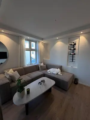 a living room with a couch and a table at Sental apartment in Sandviken in Bergen