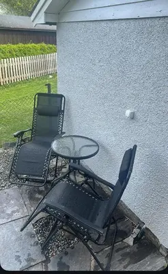 two chairs and a table next to a wall at Maria apartment with Sauna Otta in Otta