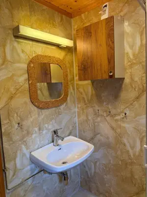 a bathroom with a sink and a mirror at Hafslo hytteutleige Straumane in Hafslo