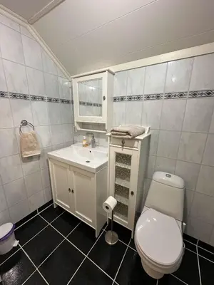 a bathroom with a toilet and a sink at Comfortable room - Double bed - Private bathroom - Free parking - Shared kitchen - Bus stop and store 2 min walk in Lunden