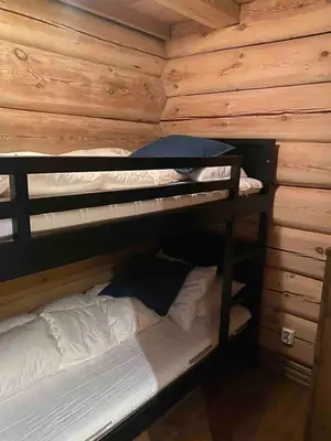 a room with two bunk beds in a cabin at Large and cozy family cabin with sauna in Trysil