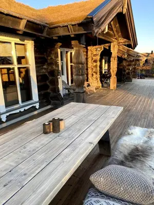 a wooden deck of a log cabin at Large and cozy family cabin with sauna in Trysil