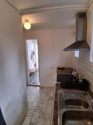 a kitchen with a sink and a counter top at Appartement calme et central sur Bergen in Bergen