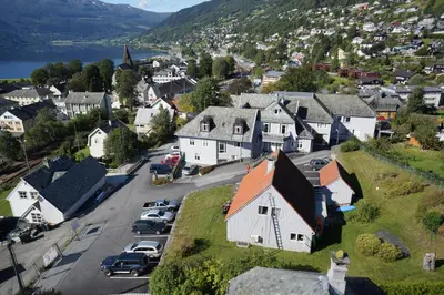 an aerial view of a small village with cars parked at Ole Bull Akademiet in Vossevangen