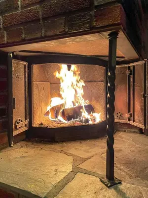 a fireplace with a fire in it at Family Cabin With Views In Valdres in Reinli
