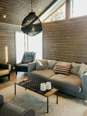 a living room with a couch and a coffee table at Modern Cabin With Breathtaking View At Norefjell in Eggedal