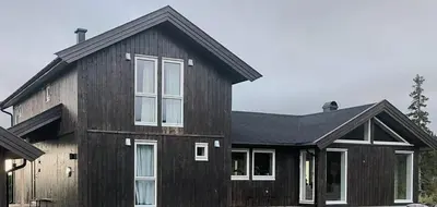 a black house with a black roof at Modern Cabin With Breathtaking View At Norefjell in Eggedal