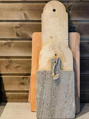a wooden bench sitting next to a wooden wall at Modern Cabin With Breathtaking View At Norefjell in Eggedal