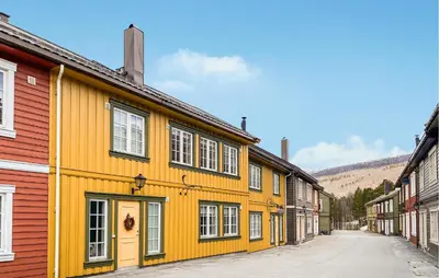 a row of colorful buildings on a street at Gorgeous Home In Bjorli With Wifi in Bjorli