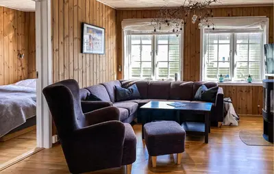 a living room with a couch and a table at Gorgeous Home In Bjorli With Wifi in Bjorli