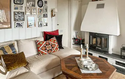 a living room with a couch and a table at Beautiful Home In Sjusjøen With Wifi in Sjusjøen