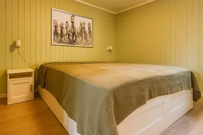 a bedroom with a large bed in a room at Leilighet sentralt i Bud in Bud