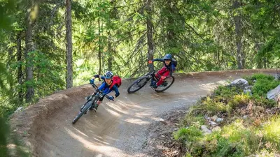 two people riding bikes on a dirt road at Trysil Caravan Cycle in-out in Trysil