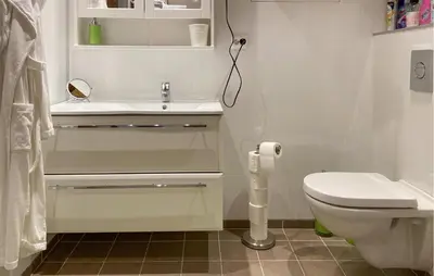 a white bathroom with a sink and a toilet at Stunning Home In Runde With Wifi in Runde