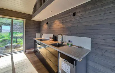 a kitchen with a sink and a counter top at Awesome Home In Sletta With Wifi in Sletta