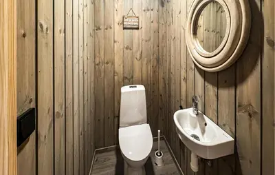 a bathroom with a toilet and a sink at Stunning Home In Engerdal With Wifi in Nymoen