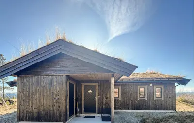 a small wooden building with a grass roof at Stunning Home In Engerdal With Wifi in Nymoen
