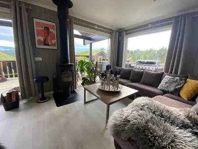 a living room with a couch and a table at Cabin for rent in scenic Stryn in Stryn