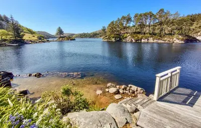 a stairway leading into a lake with a view at Beautiful Home In Urangsvåg in Rolvsnes