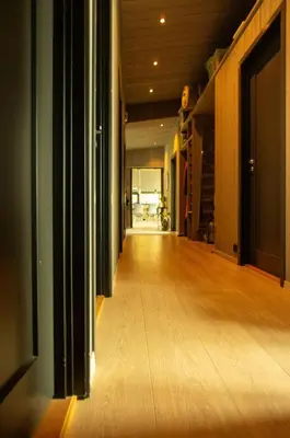 an empty hallway of a house with a wooden floor at Coastal Cabin With Ocean View On Lepsøya in Kjerstad