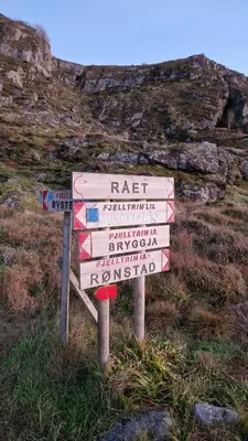 a sign on the side of a hill at Coastal Cabin With Ocean View On Lepsøya in Kjerstad