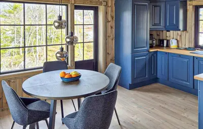 a kitchen with a table with a bowl of fruit on it at 2 Bedroom Awesome Home In Engerdal in Kvisla