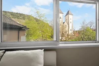 a window with a view of a castle at Bergen Beds Apartment I 100 meters from Bryggen! in Bergen