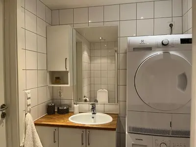 a bathroom with a sink and a mirror at Kvitfjell mountain in Strande